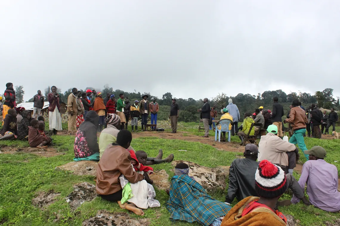 copy Benet people gather to discuss recent land disputes between their community and the Uganda Wildlife Authority in Kokwotorokwo village in eastern Uganda, May